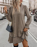 All-Over Print V Neck Dress with Tie Neck, Flare Sleeve and Layered Ruffled Hem